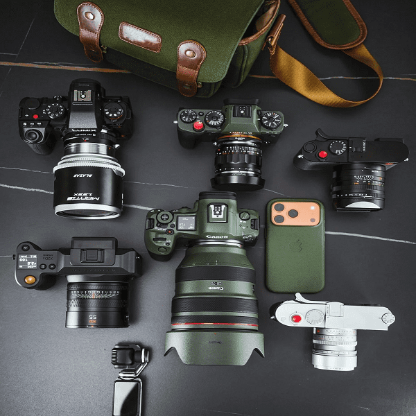 Mixed Canon, Nikon, and Sony camera pallets liquidation wholesale bulk lot featuring assorted professional and consumer digital cameras for resale inventory.